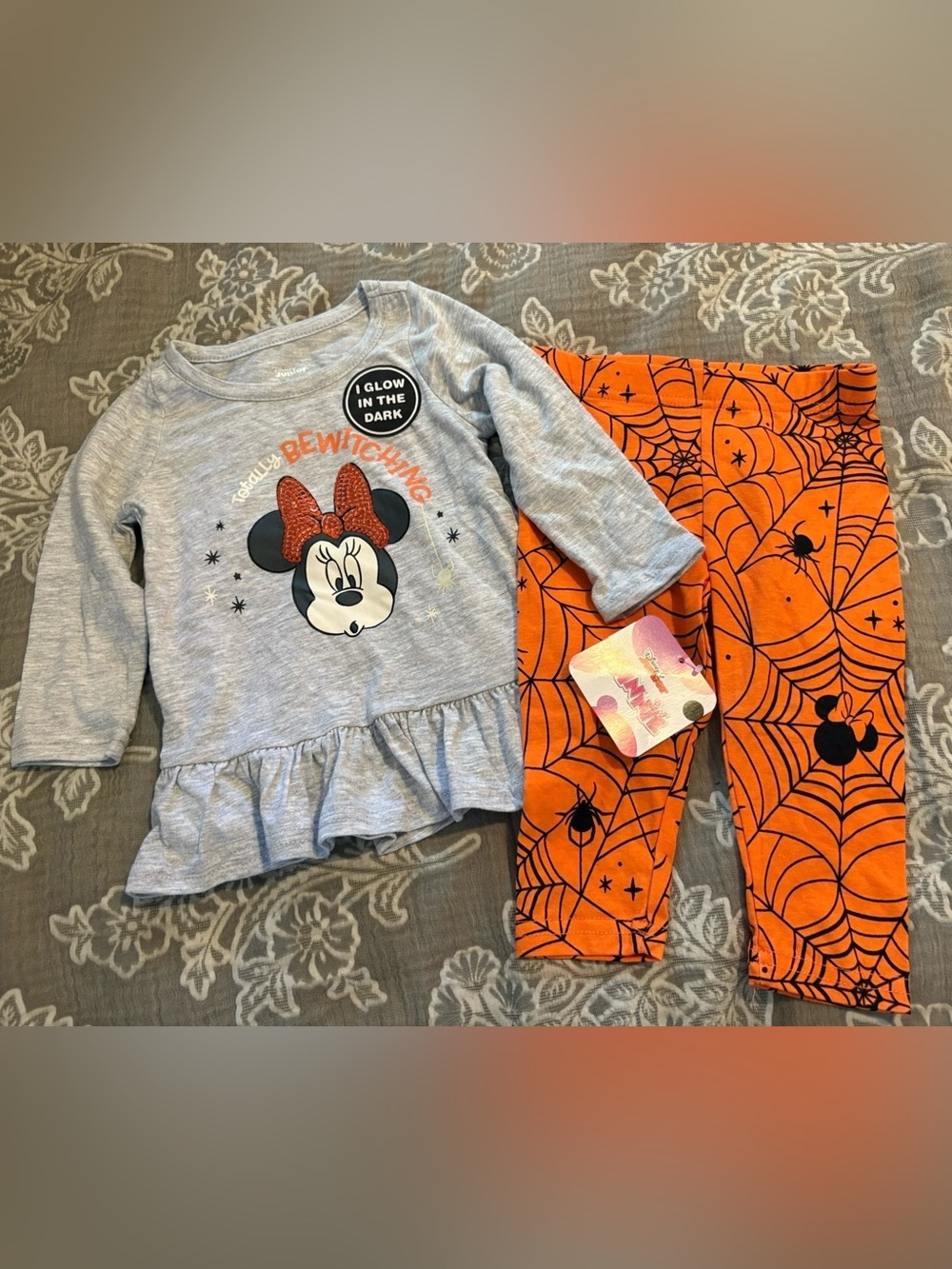Disney Minnie Mouse Halloween outfit with orange spiderweb and black spider desi